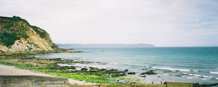 Image cropped courtesy of https://commons.wikimedia.org/wiki/File:Charlestown_Beach_St_Austell_Cornwall.jpg